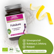 Eine Flasche gse.organic.supplements Folsäure Compact (Bio) Tabletten liegt auf weißem Pulver, daneben eine Zitronenschale; das grüne Etikett weist auf die Vorteile für Schwangerschaft, Stillen, Blutbildung und Zellteilung hin - vegan, gluten- und laktosefrei.