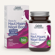 Eine Flasche und eine Schachtel von gse.organic.supplements Beauty Haut, Haare, Nägel Boost (Bio) mit lila und weißer Verpackung, die ein stilisiertes Frauenprofil zeigt und vegane, biologische B-Vitamine, Selen und Kieselerde hervorhebt.