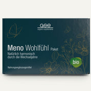 Eine dunkelgrüne Schachtel mit der Aufschrift "Meno Wohlfühl Paket" von gse organic supplements, mit botanischen Illustrationen, deutschem Text zur Unterstützung der Wechseljahre, dem Bio-Symbol und Highlights wie Yamswurzelpulver.